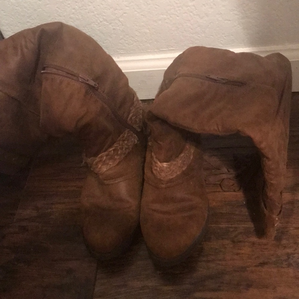 1 pair of knee length cowgirl boots.